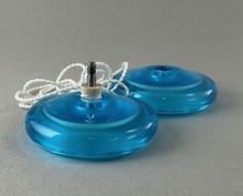 Unscrewed yo-yo showing wooden axle and string.